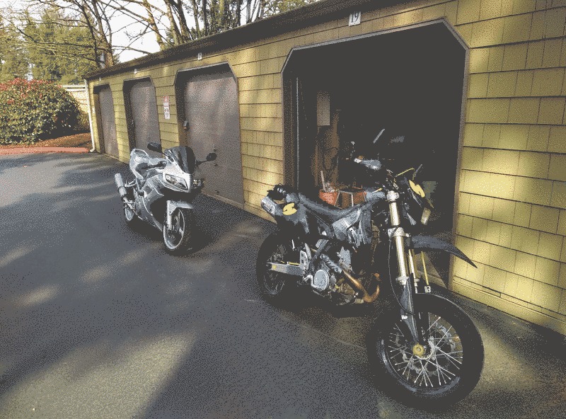 Two motorcycles, the DRZ-400 and an SV1000S.