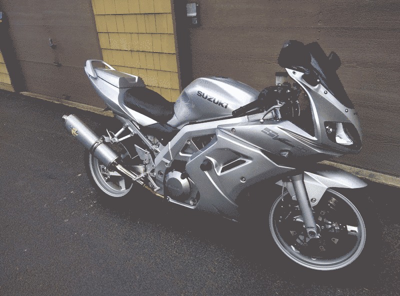 A picture of a silver motorcycle.